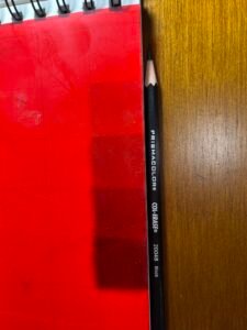 red acetate lying on a value scale