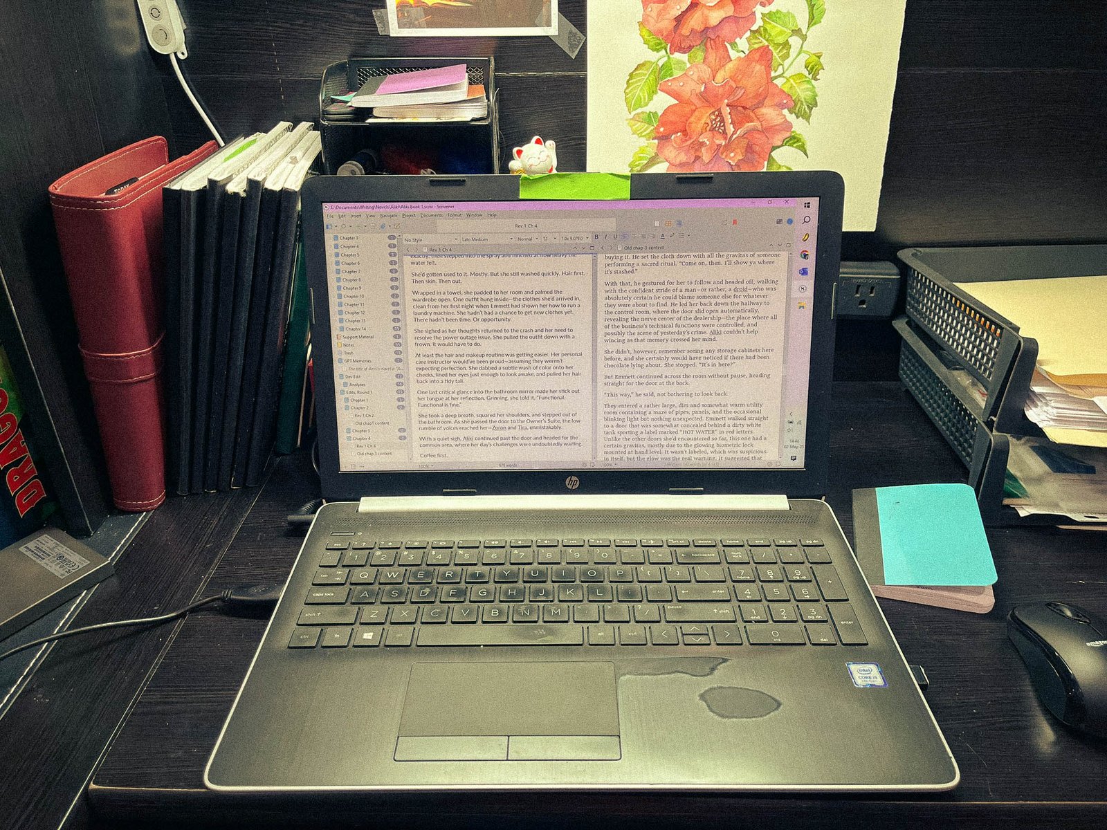 A worn, open laptop shows an editing program in progress.