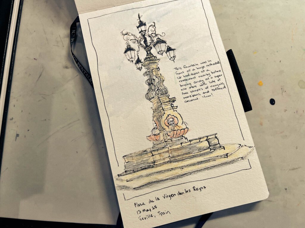Hand-drawn fountain sketch from Seville, with notes and travel memories in a sketchbook.