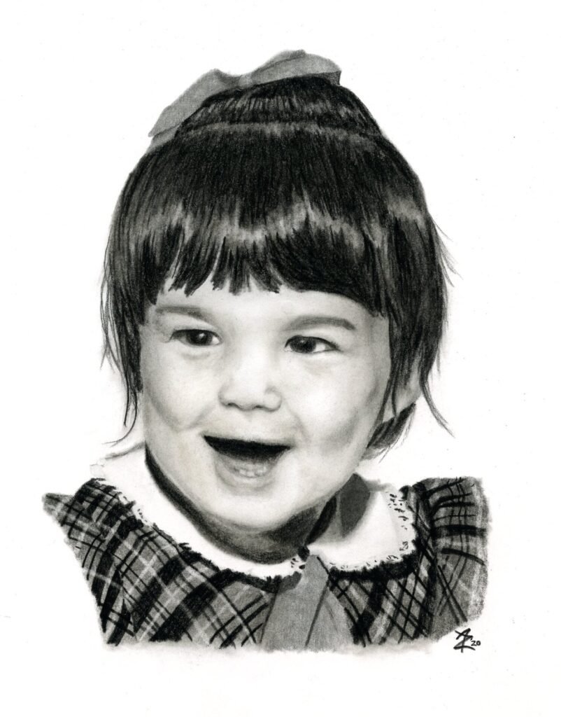 Graphite and charcoal portrait of a smiling two-year-old girl with dark hair, a bow, and a plaid dress.