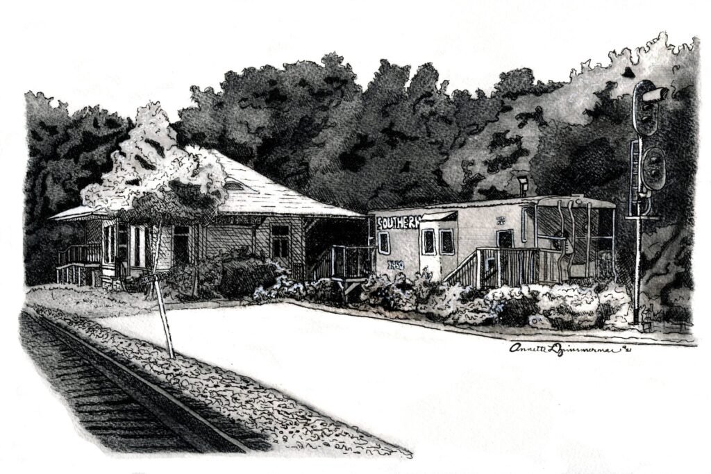 Graphite and ink study of the depot beside the railroad tracks, with surrounding trees, signs, and trackside details.
