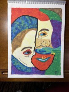Colorful oil pastel portrait inspired by Picasso, showing an abstract face with divided features, bold colors, and a ring in the nose.