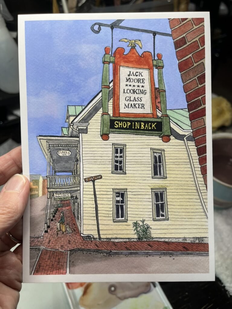 Finished 5×7 watercolor and ink print of Jack Moore’s Looking Glass Maker sign above the Eureka Inn, with a boy and cat beneath the porch.