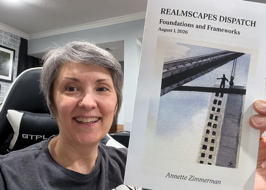 Anni holds the August 2026 Realmscapes Dispatch, titled “Foundations and Frameworks.” Its cover shows two small figures on steel beams high above a building.