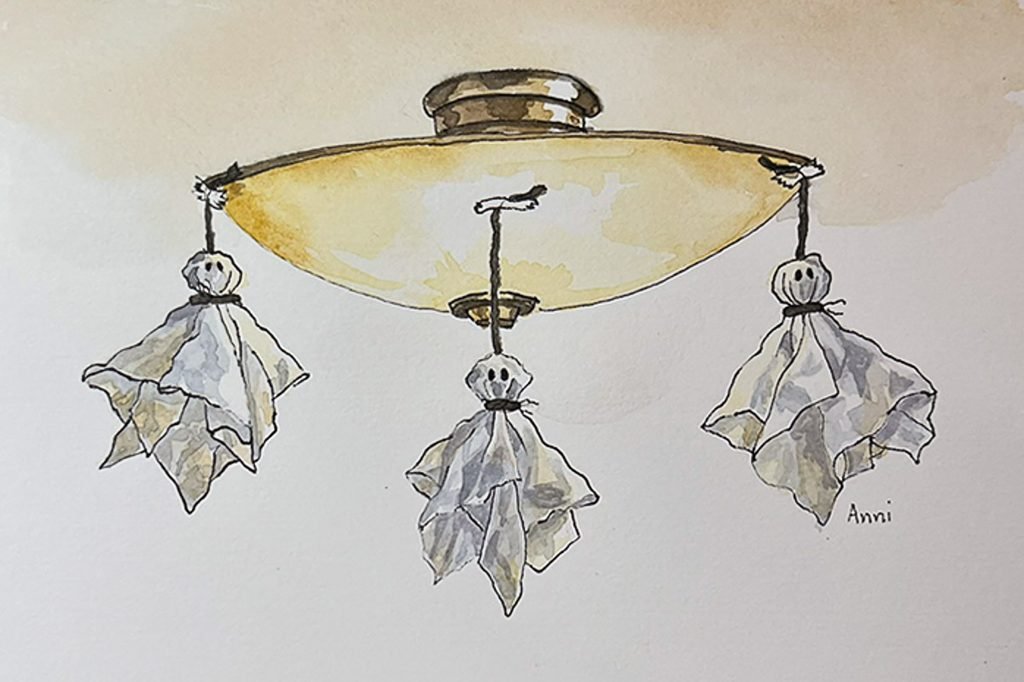 Ink and watercolor illustration of three homemade tissue ghosts with black dot eyes, hanging by yarn from a glowing yellow ceiling light.